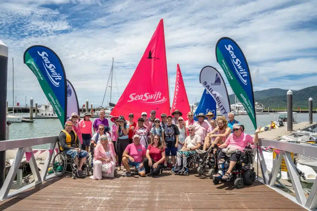 A group shot of participating members of the Sailability event, at the Cairns Port.